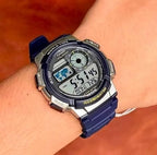 Digi Bear Casio Collection AE-1000W-2AVDF digital watch with a blue resin strap and world time display on a wrist