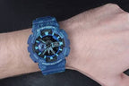 Digi Bear Casio G-Shock GA-110TX-2ADR blue resin sports watch with patterned strap worn on a wrist
