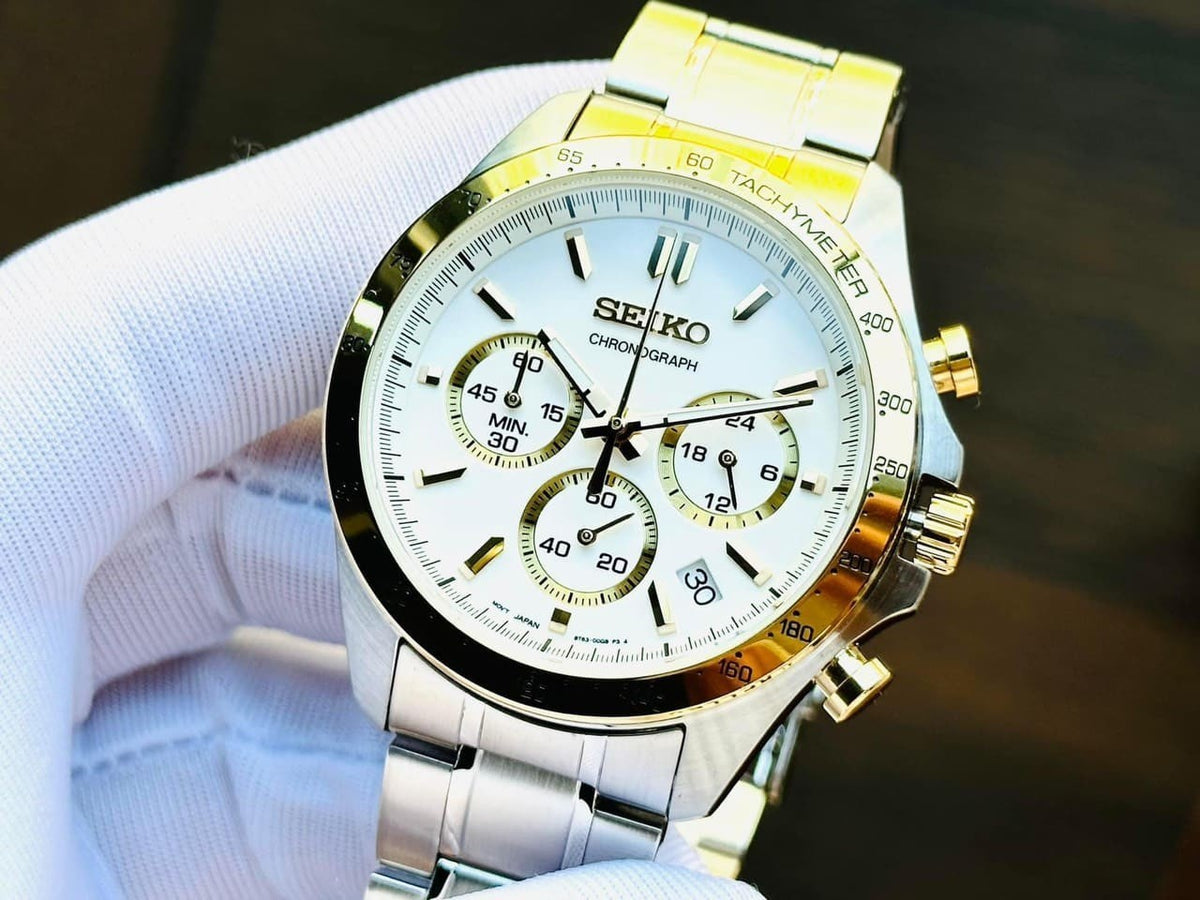 Digi Bear Seiko SBTR024 chronograph watch with a white dial, gold accents, and a stainless steel bracelet.