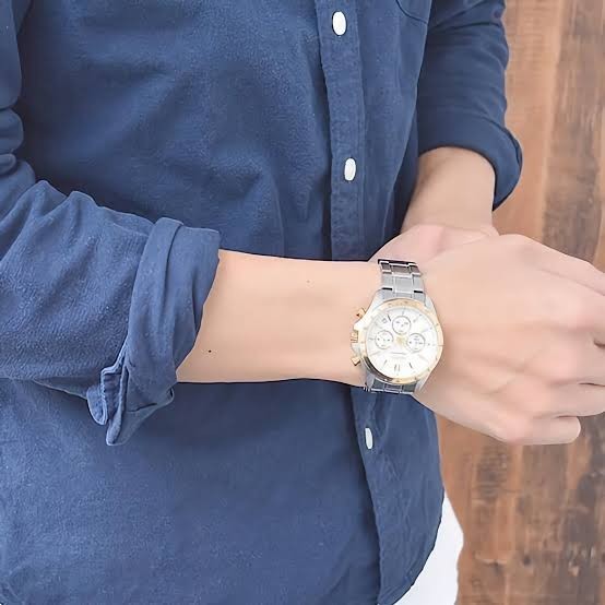 Digi Bear Seiko SBTR024 chronograph watch with a silver and gold stainless steel band worn on a man's wrist