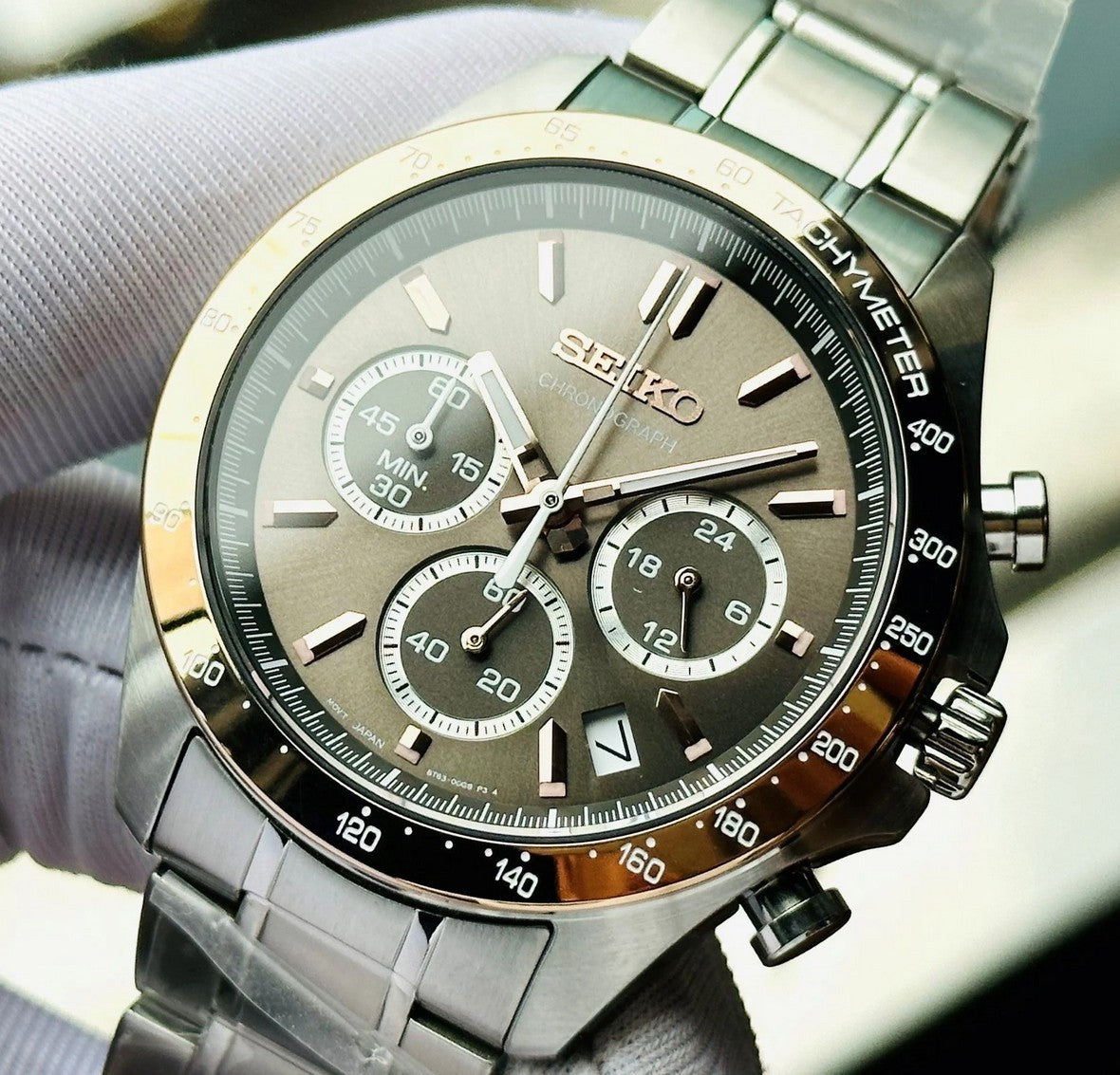 Digi Bear Seiko SBTR026 chronograph watch with a grey dial, rose gold accents, and a stainless steel bracelet.