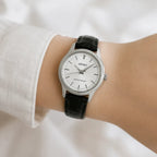 Digi Bear Seiko SSXP001 classic watch with a white dial, silver case, and black leather strap worn on a wrist